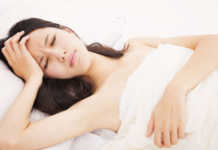 6 Types of Headaches: Causes & How to Get Rid of Them woman-in-bed-with-headache